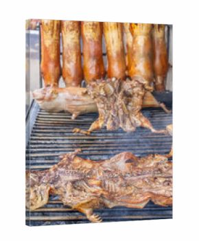 Typical food of Ecuador: guinea pig roasting on the grill, prepared with traditional Andean techniques that preserve cultural essence and offer a unique gastronomic experience.