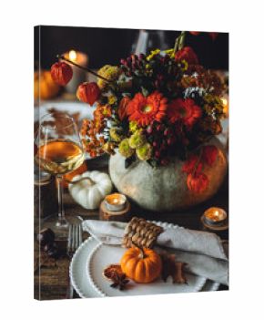 Fall table decoration with pumpkins, wine. Family cozy thanksgiving dinner arrangement indoors at home, wedding elegant decor. Countryside style, simple handmade setting, autumn mood, inspiration.