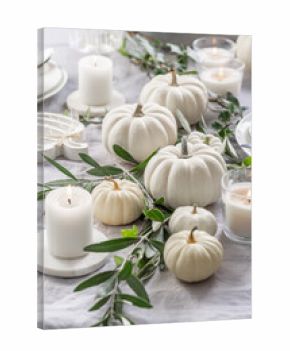 Place settings with white pumpkins for Thanksgiving