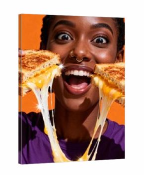 Excited woman holding a gooey grilled cheese sandwich with melted cheese stretching out