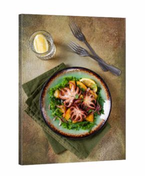 Warm salad, grilled mini octopus, with potatoes and fresh herbs, homemade,no people