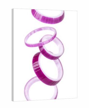 Falling red onion rings creating dynamic movement. Sliced purple vegetable preparing fresh healthy cooking ingredients