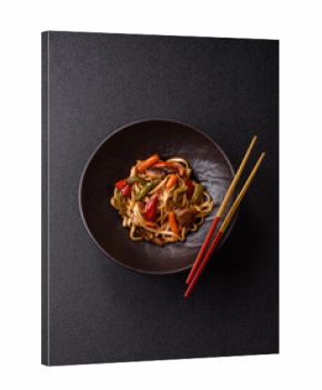 Asian food, noodles with vegetables, vegetarian dish with spicy sauce. Noodles with vegetables