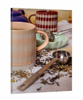 Tea mugs with measuring spoon, tea strainer, and loose tea