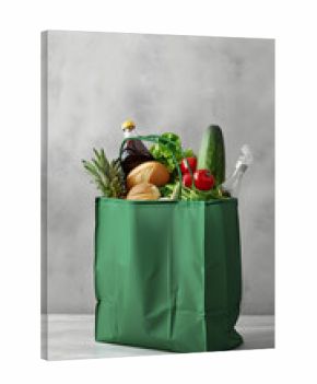 Fresh groceries in a green shopping bag on isolated background — perfect for grocery branding, used for food marketing and retail ads.