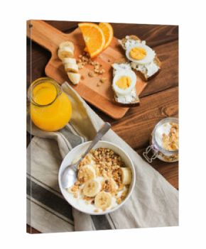 healthy breakfast bowl of yogurt with granola and eggs