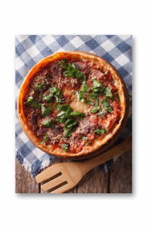 Chicago deep dish pizza close-up on the table. vertical top view   