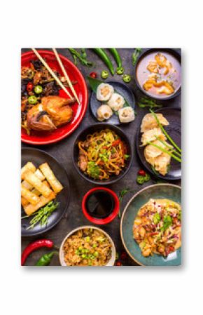 Assorted Chinese food set. Chinese noodles, fried rice, dumplings, peking duck, dim sum, spring rolls. Famous Chinese cuisine dishes on table. Top view. Chinese restaurant concept. Asian style banquet
