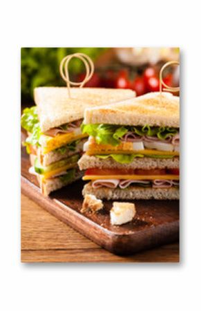 Delicious toast sandwich with ham, cheese, egg and vegetables.