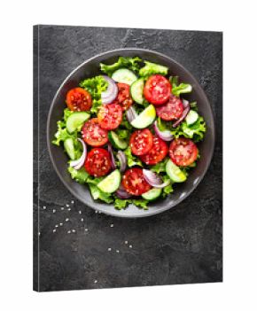 Salad. Fresh vegetable salad with tomato, cucumber, lettuce and red onion