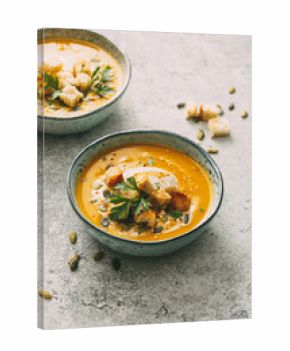 Pumpkin and carrot soup with cream and parsley. Concept for healthy eating and nutrition.