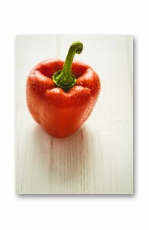 Fresh red pepper on wooden table
