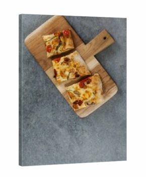Pizza slices on wooden tray
