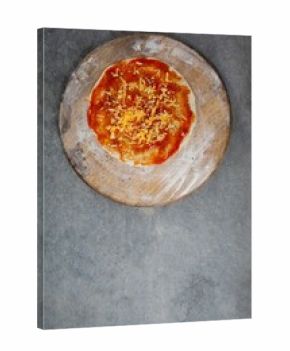 Fresh pizza on wooden cutting board