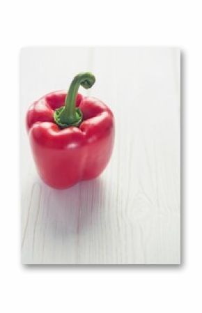 Fresh red pepper on wooden table