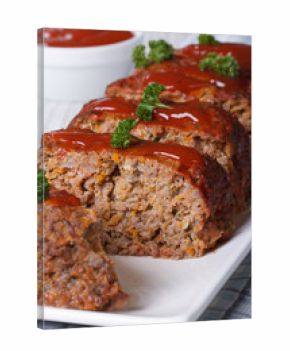 sliced meat loaf with ketchup and parsley close-up
