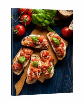 Italian bruschetta with roasted tomatoes, mozzarella cheese and