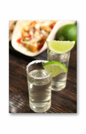 Tequila glasses with lime slices, closeup