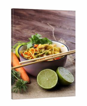 Traditional indonesian meal bami goreng with noodles, vegetables