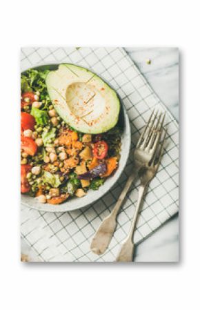 Vegan lunch bowl. Dinner with avocado, mixed grains, beans, sprouts, greens and vegetables over marble table, top view. Vegetarian, clean eating, healthy diet food concept