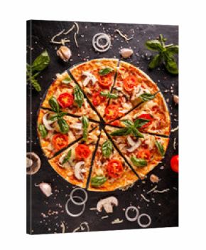 Flat lay with Italian pizza on black background and various ingredients