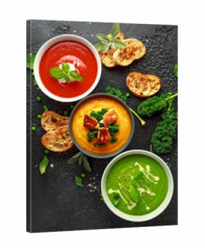 Variety of cream soup bowls: sweet pea and mint, tomato and basil and butternut squash with steamed kale and fried halluomi