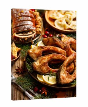 Christmas carp, Fried carp fish slices on a ceramic plate, close up, top view. Traditional christmas eve dish. Polish Christmas