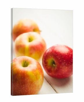 Fresh red apples on table