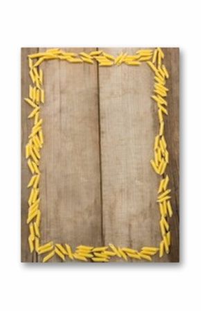 Penne pastas arranged on wooden table