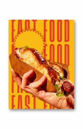 Hand holding delicious hot dog sandwich with grilled sausage, salad and bun on bold yellow background with fast food typography. Conceptual design. Concept of food, pop art, poster, ad