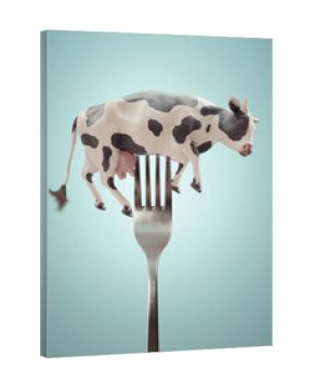 Cow on a fork. Diet and weight loss concept.