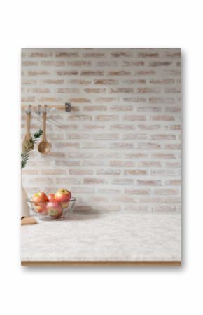 A showcasing space on a white marble tabletop against the brick wall in a Scandinavian kitchen.