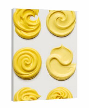 Abstract 3D Rendering of Yellow Swirls With Smooth Creamy Texture on White