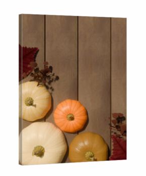 Autumn pumpkins with fall leaves on wooden background for thanksgiving decoration. 3d rendering
