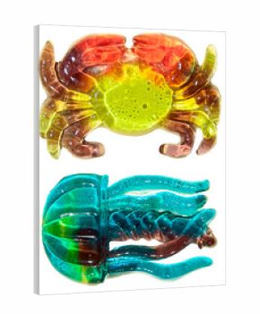 massive, detailed 3d render of two colorful, translucent gummy candies shaped like a crab and a jellyfish, isolated on a transparent background.