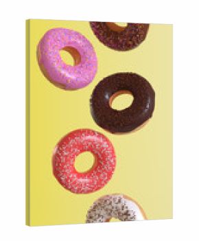 Different donuts fly on a yellow background. Minimal concept. 3d render illustration