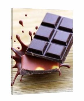 abstract 3d dark chocolate bar with chocolate cream splashing isolated on white background 