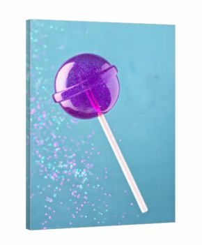 purple lollipop with glitter on blue background