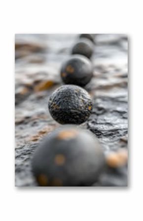 Abstract Dark Gray Spheres in a Line on Textured Surface