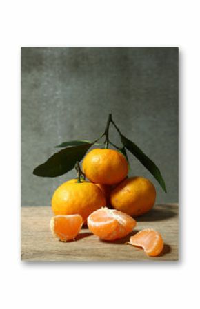 Still life with orange fruites on wooden table