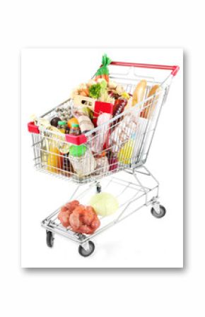 Shopping cart full with various groceries isolated on white