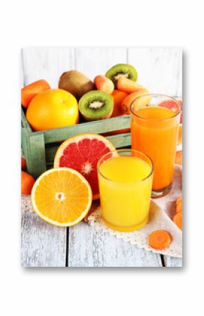 Fruit and vegetable juice in glasses and fresh fruits in box