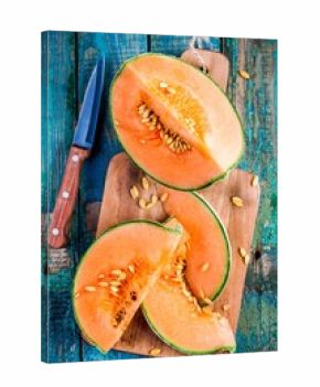 sliced ripe melon on a cutting board