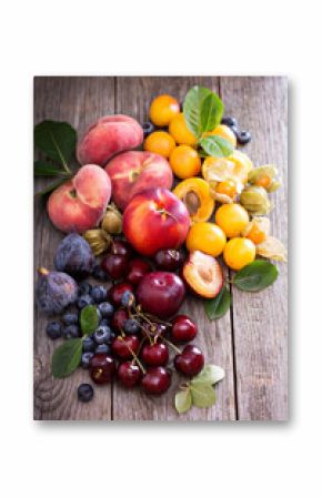 Fresh stone fruits on wooden table