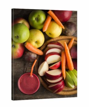 Glass of fresh beetroot, apple and carrot juice