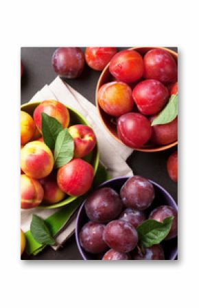Fresh ripe peaches and plums