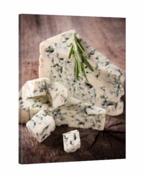 Blue cheese on wooden background