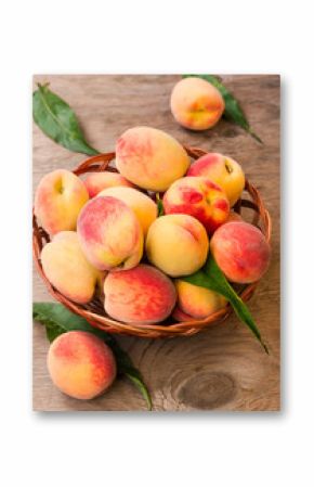 Ripe peaches in a wicker basket