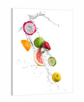 Pieces of exotic fruit in water splash