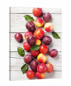 Fresh ripe peaches and plums